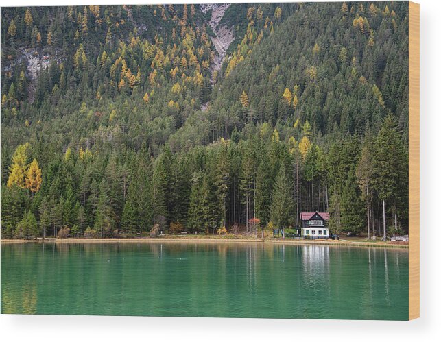 Italy Wood Print featuring the photograph House in the lake and forest. Lago di dobbiaco lake. Italian aps by Michalakis Ppalis
