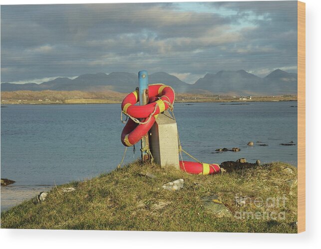 Lifebuoy Connemara Ballyconneely Galway Ireland Saftey Outdoors Ocean Mountains Beach Walking Photography Wood Print featuring the photograph Life savers by Peter Skelton