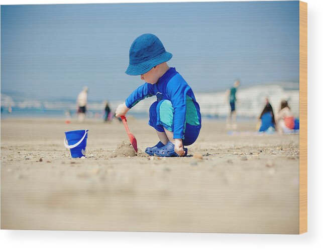 Toddler Wood Print featuring the photograph Making sandcastles by s0ulsurfing - Jason Swain