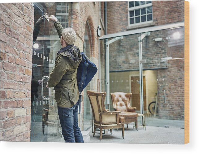 Working Wood Print featuring the photograph Male coffee shop owner unlocking door by GS Visuals