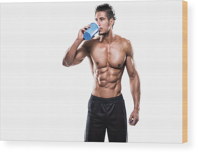 Protein Drink Wood Print featuring the photograph Male fitness athlete drinking protein shake by Extreme-photographer