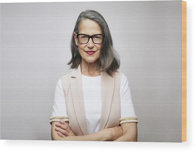 Expertise Wood Print featuring the photograph Mature female CEO with arms crossed by Morsa Images