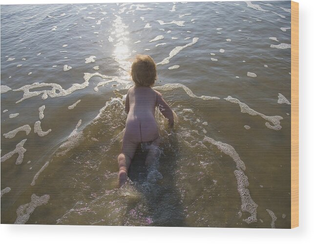 White People Wood Print featuring the photograph Naked baby girl (9-12 months) crawling through water by Marc Romanelli