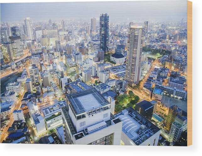 Apartment Wood Print featuring the photograph Osaka cityscape at night, illuminated high rise buildings, Japan by Urbancow