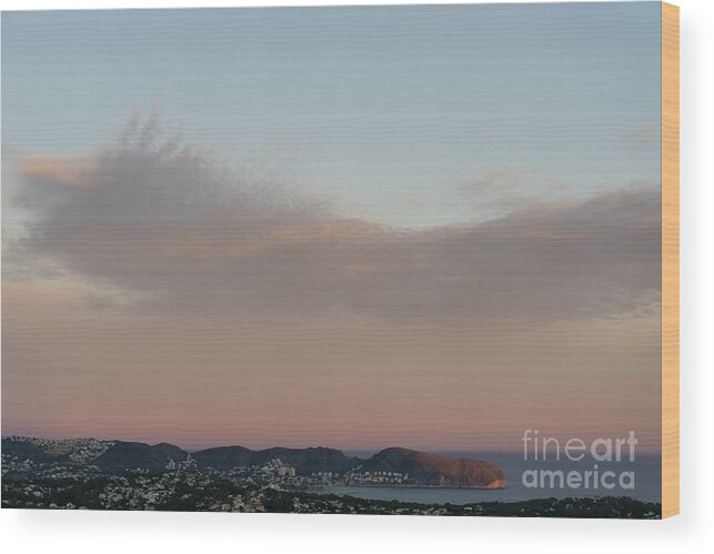 Mediterranean Coast Wood Print featuring the photograph Pale pink sky and soft clouds at sunset on the Mediterranean coast by Adriana Mueller
