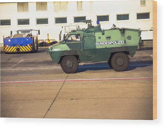 People Wood Print featuring the photograph Police armored protection vehicle in International Frankfurt Airport, by Flik47