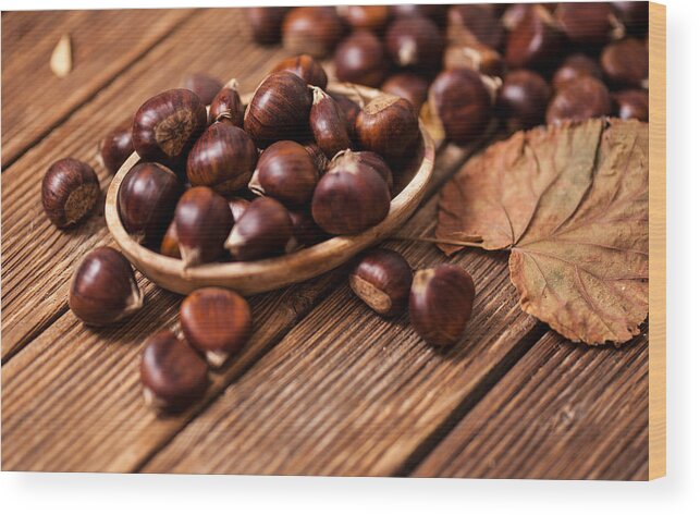 Horse Wood Print featuring the photograph Ripe chestnuts in a frying pan on old wooden table close up with copy space. Roasted Chestnuts for Christmas'n by Đorđe Banjanin