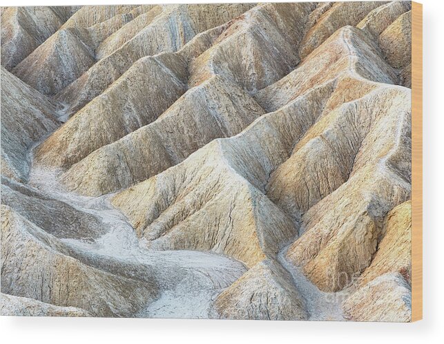 Death Valley Wood Print featuring the photograph Ripples of eroded stone at Zabriskie Point, Death Valley, California. by Jane Rix