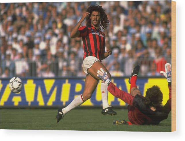 1980-1989 Wood Print featuring the photograph Ruud Gullit of AC Milan races to intercept the ball by Getty Images