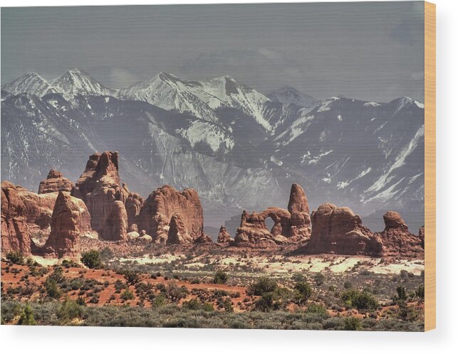 Arches Wood Print featuring the photograph Sandstone formations and Turret Arch vista in Arches National Park with La Sal mountains behind by Peter Herman