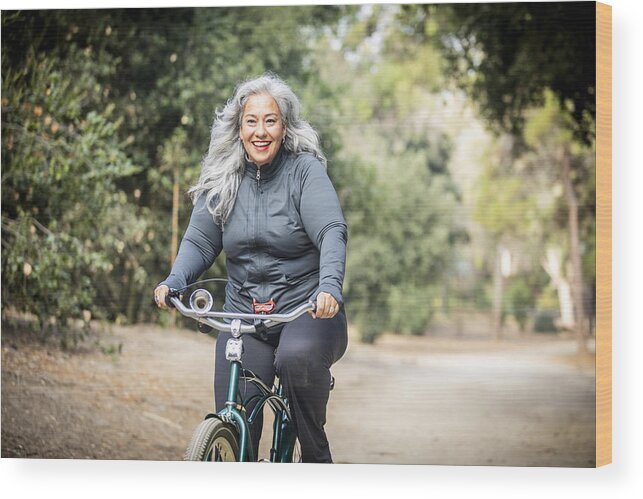 Mature Adult Wood Print featuring the photograph Senior Mexican Woman Riding Bicycle by Adamkaz