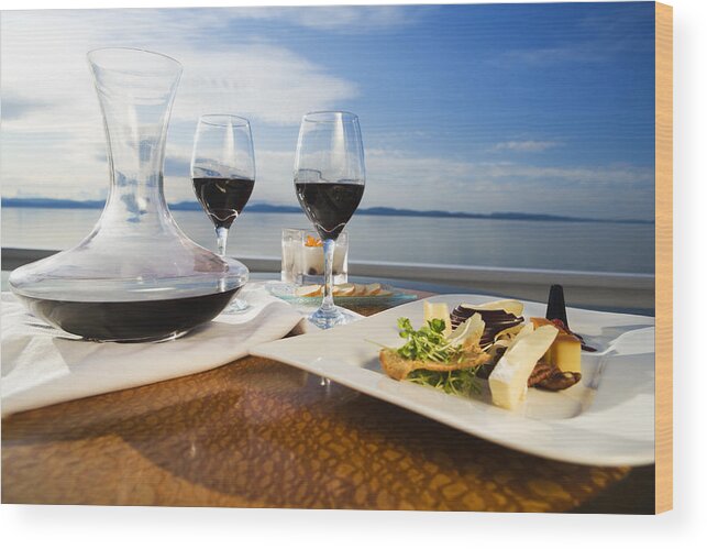 Scenics Wood Print featuring the photograph Set table with gourmet appetizer and two glasses on red wine by Twohumans