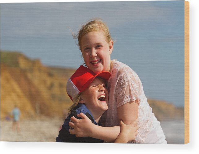 Sibling Wood Print featuring the photograph Siblings hugging by s0ulsurfing - Jason Swain