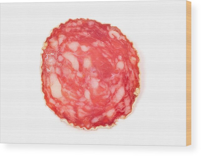 White Background Wood Print featuring the photograph Slices of salami sausages by R.Tsubin