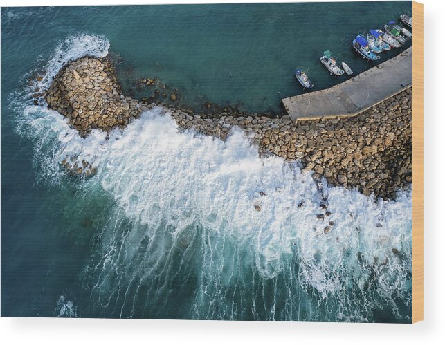 Brakewater Wood Print featuring the photograph Stormy windy waves on the shore. Drone photography. by Michalakis Ppalis