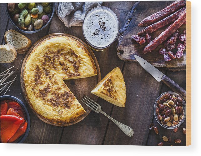 Breakfast Wood Print featuring the photograph Tapas: spanish tortilla, chorizo, pimientos, olives and beer shot from above by Fcafotodigital