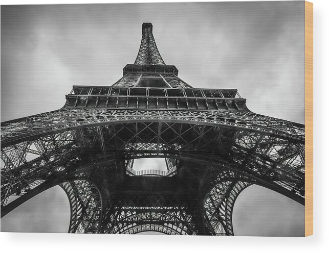 Eiffel Tower Wood Print featuring the photograph The Eiffel Tower in Paris France Seen From Below in Black and White by Alexios Ntounas