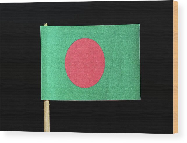  Bangladesh Wood Print featuring the photograph The national flag of Bangladesh on toothpick on black background. A red disc on a green field by Vaclav Sonnek