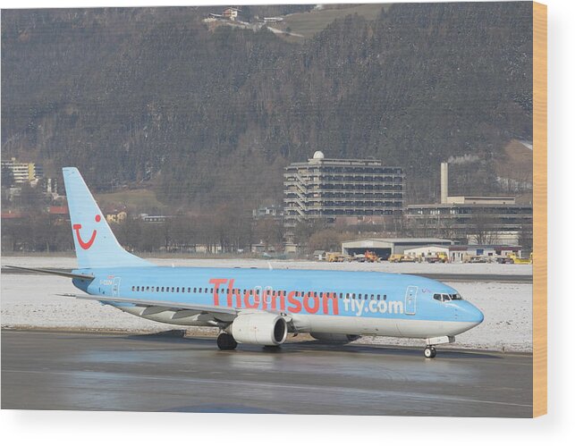 Taxiing Wood Print featuring the photograph Thomson Fly Boeing 737 passenger jet in Innsbruck by Pejft
