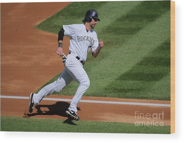 Scoring Wood Print featuring the photograph Todd Helton, Manny Parra, and Garrett Atkins by Doug Pensinger