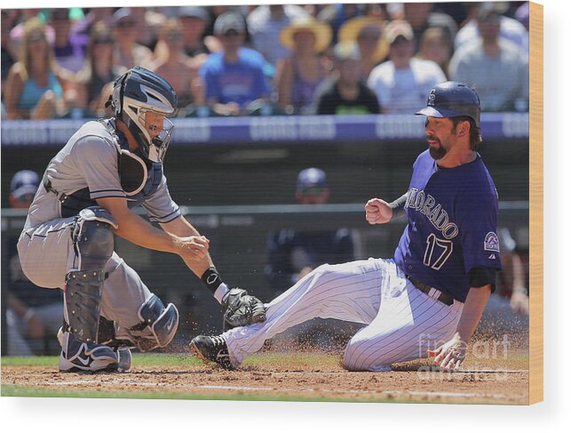 Second Inning Wood Print featuring the photograph Todd Helton, Nick Hundley, and Jonathan Herrera by Doug Pensinger