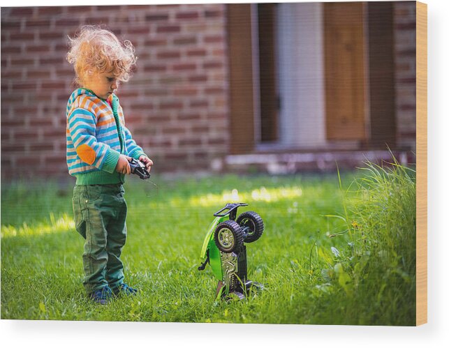 Toddler Wood Print featuring the photograph Toddler with toy car by © Razvan Ciuca