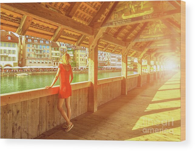 Lucerne Wood Print featuring the photograph Tourist on Lucerne bridge by Benny Marty