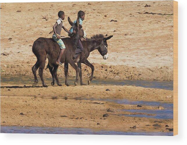 Two Boys Wood Print featuring the photograph Two Boys Riding Donkeys Along the River in Angola by Belinda Greb
