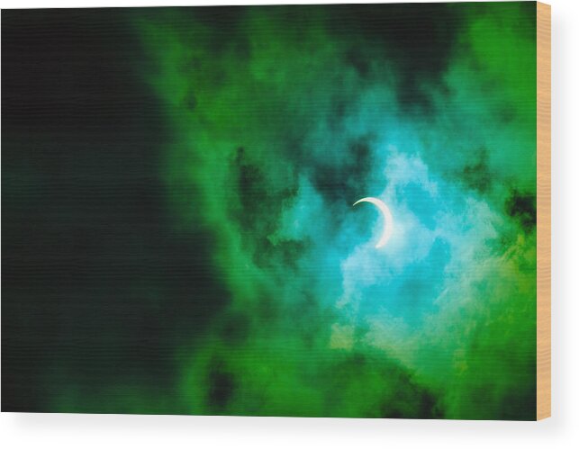 Event Wood Print featuring the photograph View of partial annular solar eclipse in Kuala Lumpur with dramatic colour. by Shaifulzamri