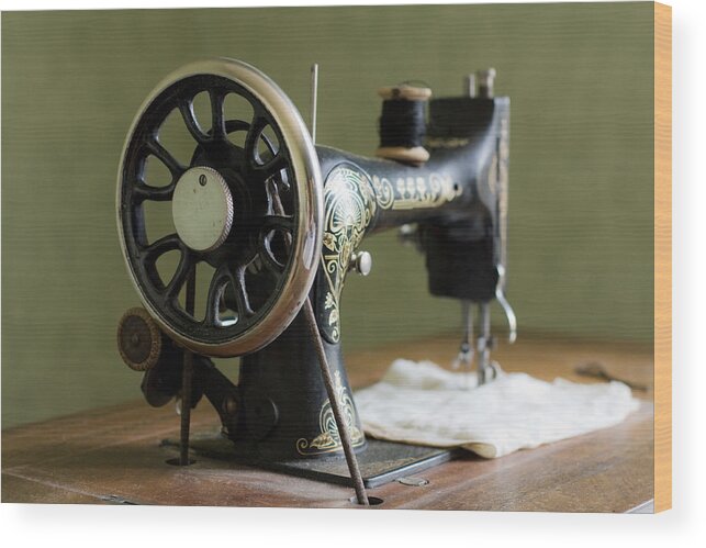 Manufacturing Equipment Wood Print featuring the photograph Vintage sewing machine by By Eleonore Bridge