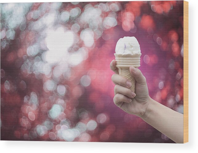 Holding Wood Print featuring the photograph woman hand holding Ice cream with summer blue sky by IttoIlmatar