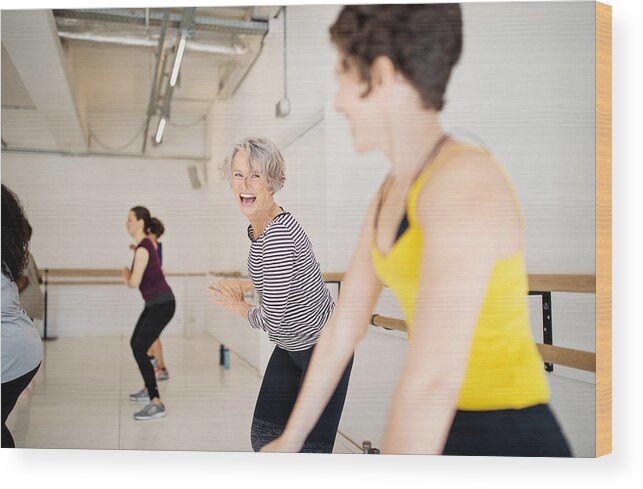 Mid Adult Women Wood Print featuring the photograph Women enjoying a dance routine in fitness studio by Luis Alvarez
