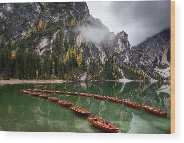 Lago Di Braies Wood Print featuring the photograph Wooden boats on the peaceful lake. Lago di braies, Italy by Michalakis Ppalis