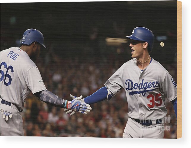 Three Quarter Length Wood Print featuring the photograph Yasiel Puig and Cody Bellinger by Christian Petersen