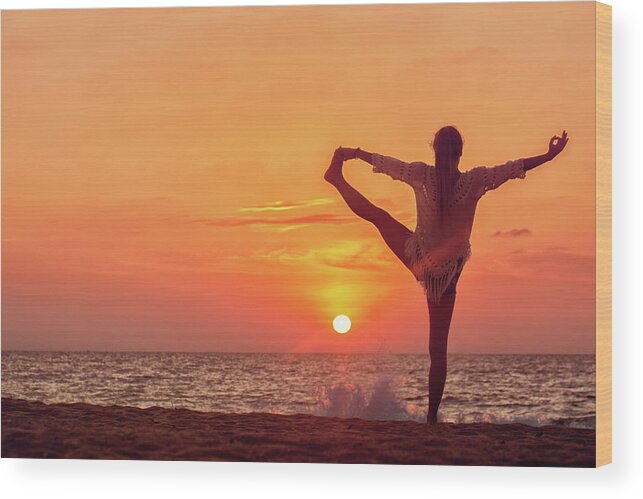 Golden Hour Wood Print featuring the photograph Yoga at sunset by Iuliia Malivanchuk