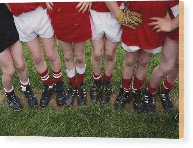 Child Wood Print featuring the photograph Young Soccer Players Legs by Grant Faint