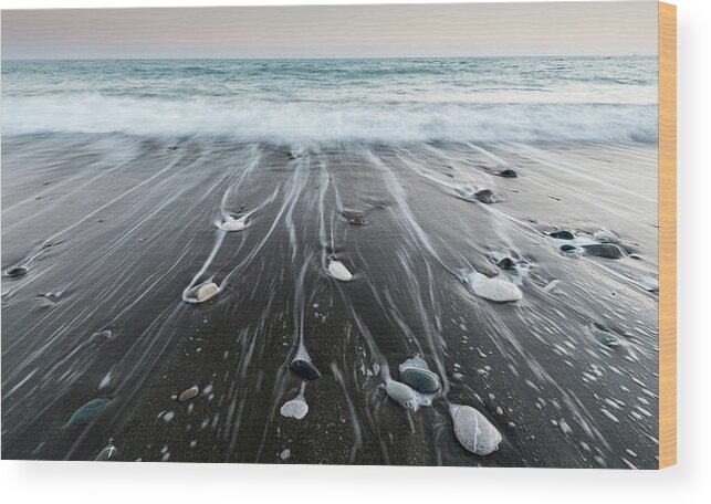 Seascape Wood Print featuring the photograph Pebbles in the beach and flowing sea water by Michalakis Ppalis