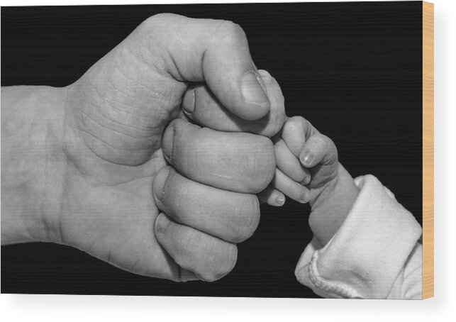 New Born Wood Print featuring the photograph New born fist bump by Joe Holley