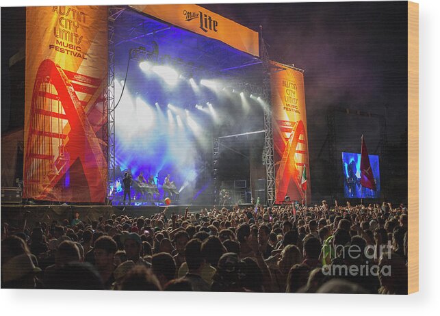 Austin City Limits Music Festival Wood Print featuring the photograph Thousands of concert goers at the ACL Austin City Limits outdoor music festival are greated by a state of the art light shows and mammoth stages by Dan Herron