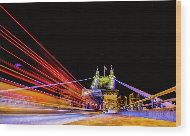 Town Wood Print featuring the photograph A Party Bus Crosses the Roebling Bridge Cincinnati Ohio by Dave Morgan