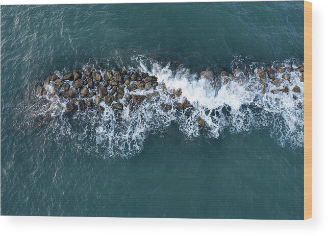 Ocean Wood Print featuring the photograph Aerial view from a flying drone of blue sea water and break water. Sea wall coastline by Michalakis Ppalis