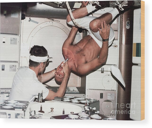 People Wood Print featuring the photograph Astronaut Gets Upside-down Oral Exam by Bettmann