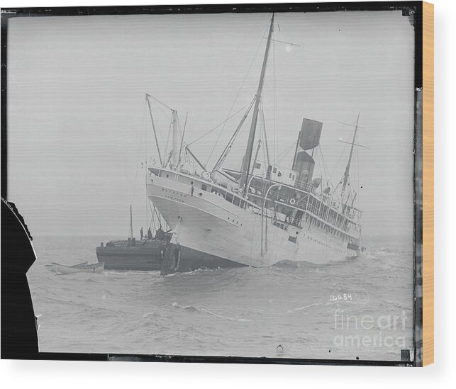 Following Wood Print featuring the photograph S.s. Metepan After Collision by Bettmann