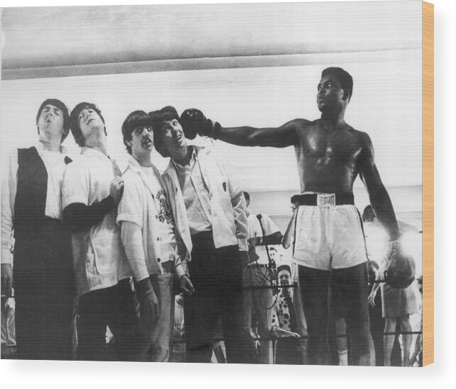 Sports Training Wood Print featuring the photograph The Beatles And Muhammad Ali In 1964 by Keystone-france