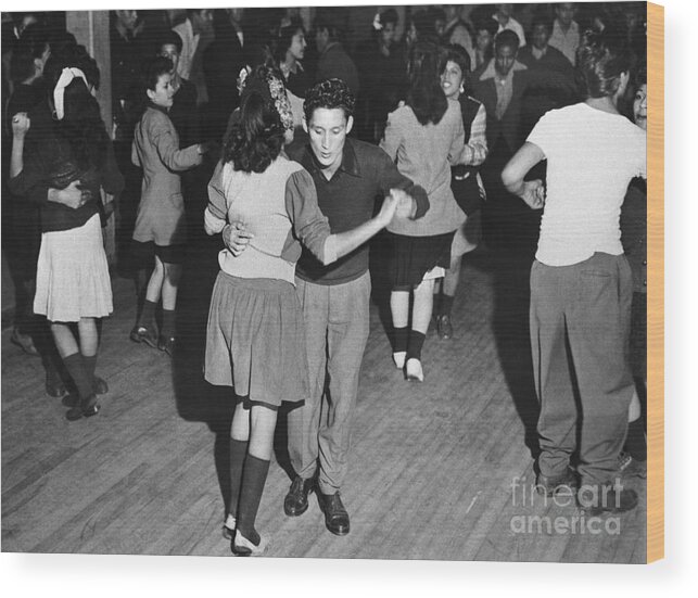Crowd Of People Wood Print featuring the photograph Zoot Suited Teenagers Jitterbugging by Bettmann