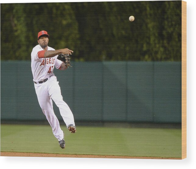 Second Inning Wood Print featuring the photograph Justin Smoak and Howie Kendrick by Harry How