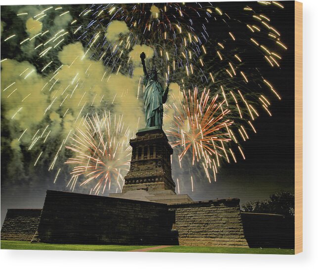 Statue Of Liberty Wood Print featuring the photograph Statue of Liberty with fire works by Montez Kerr