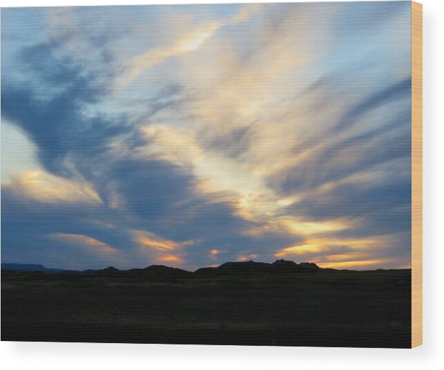 Sunset Wood Print featuring the photograph Swirling clouds at Sunset by Katie Keenan