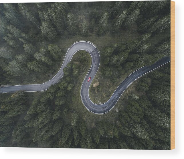 Scenics Wood Print featuring the photograph Winding forest road seen and a car shot by drone, Dolomites, Italy by Abstract Aerial Art