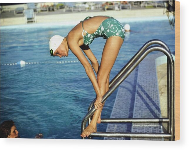 Fashion Wood Print featuring the photograph Model Wearing A Mirella Swimsuit by Arthur Elgort